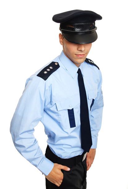 Młody policjant z ręką w kieszeni - Zdjęcie, obraz