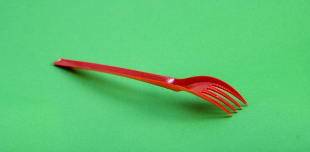 Red plastic disposable fork - Фото, изображение