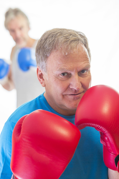 Senior man posing in boxing stance  - Fotografie, Obrázek