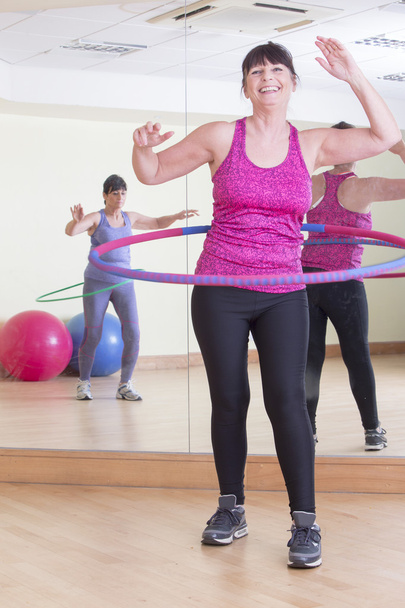 Women using hoops at the gym  - Photo, image