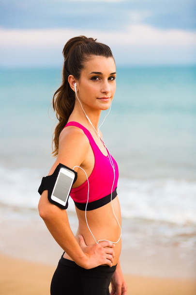 Young Healthy Fitness Woman with Smart Phone - Foto, afbeelding