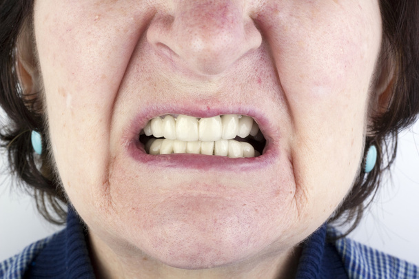 Elderly woman with new ceramic dentures - 写真・画像