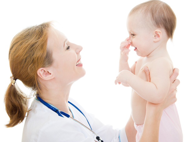 Doctor holding a baby in her arms on a white background. - Foto, Bild