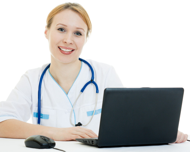 A woman doctor consultant with a laptop on a white background. - Fotografie, Obrázek