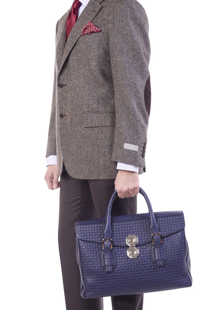 A man with a handbags in his hand - Foto, Imagen