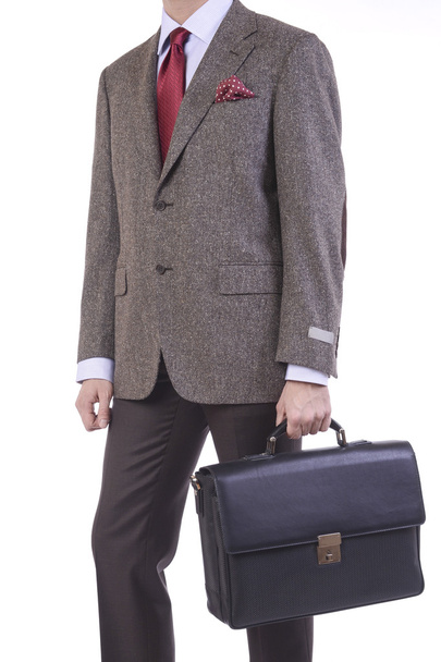 A man with a handbags in his hand - Zdjęcie, obraz