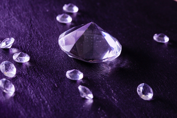 Different diamonds on purple background - Photo, image