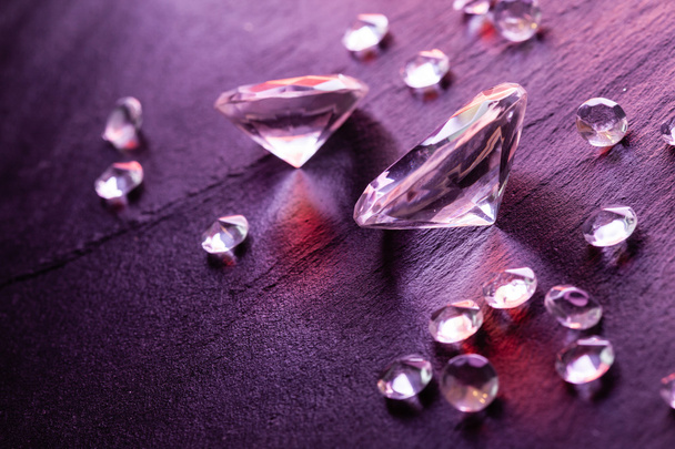Different diamonds on purple background - Foto, immagini
