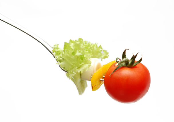 Cherry tomato on fork - Фото, изображение