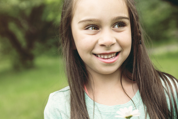 Adorable little girl in the forest meadow - Фото, зображення