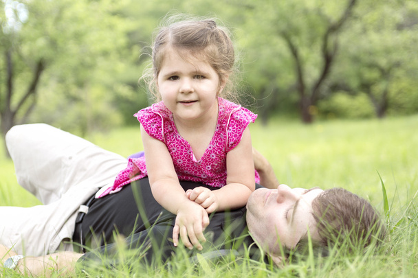Father and daughter in forest on a meadow - Foto, Imagem