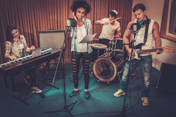 music band performing in a recording studio - Photo, Image