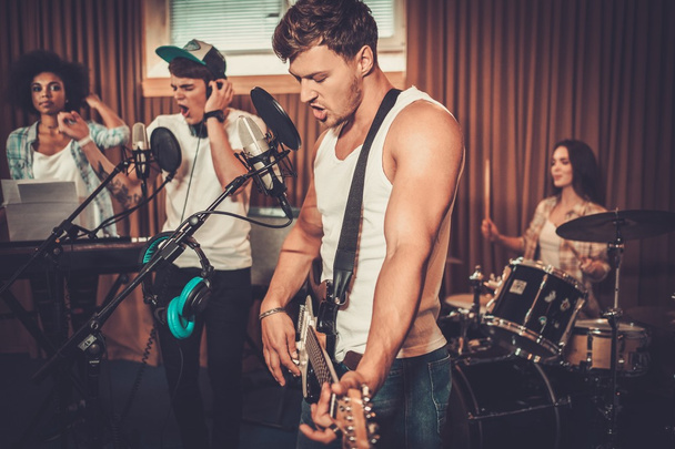music band performing in a recording studio - Photo, Image