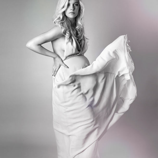 Young beautiful sexy and stylish pregnant woman.Blonde bride in wedding dress - Photo, Image