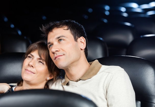 Loving Couple Watching Movie In Theater - Foto, Bild