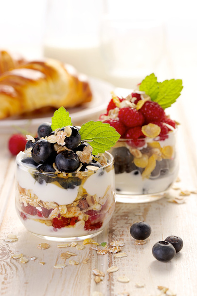 Healthy yogurt parfait with fresh raspberries, blueberries and granola - Photo, Image