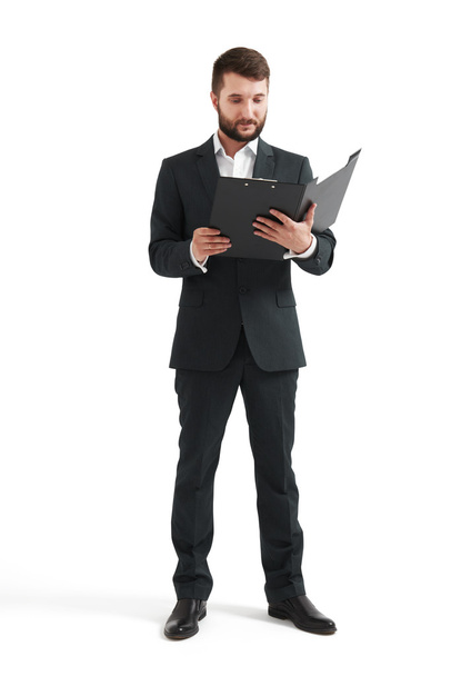 man in formal wear reading documents - Foto, Imagen