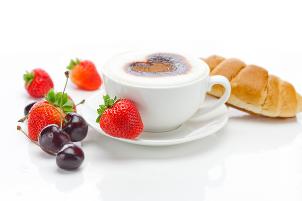 Cappuccino in a cup in the shape of hearts,cherry,croissant and - Photo, Image