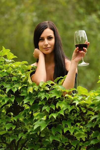 Girl in garden with wine - Fotografie, Obrázek