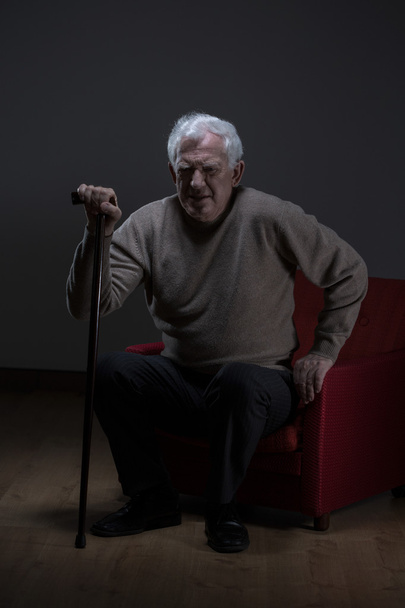 Senior man using walking stick - Foto, afbeelding