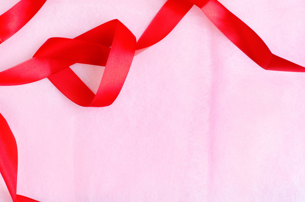 Rosy pink paper texture background with red ribbon - Photo, Image