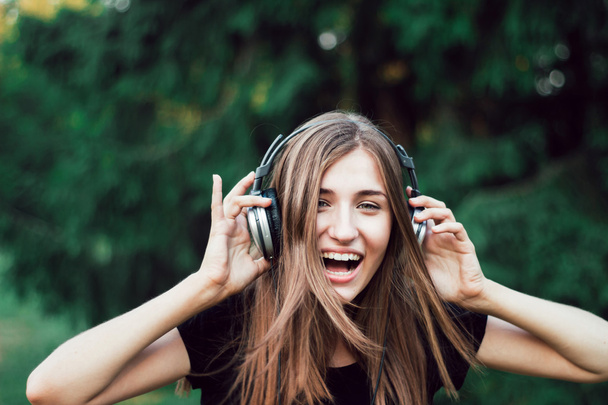 Happy girl laughs . Funny music. - Photo, Image