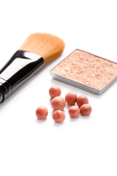 Blusher/powder balls and a cosmetic brush, closeup shot - Photo, Image