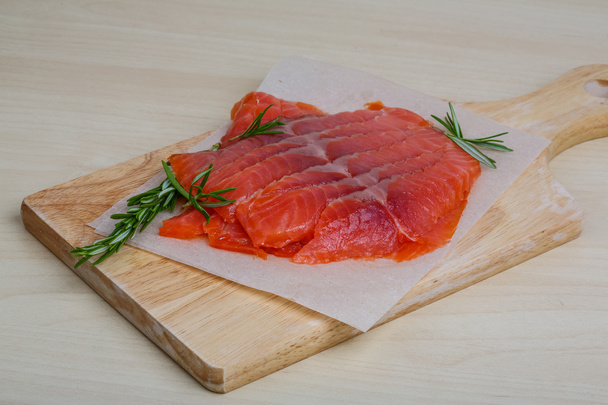 Sliced salmon with rosemary - Photo, Image