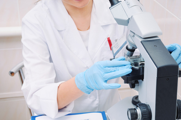 medical researcher working with microscope in laboratory - Photo, Image