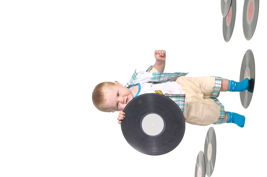 Little baby boy holding a vynil disk - Photo, Image