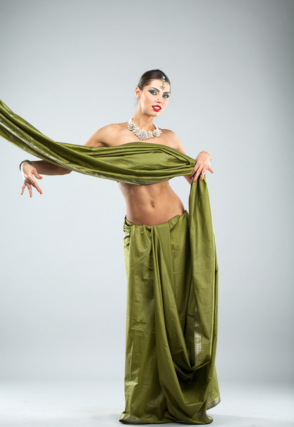 Young pretty woman in indian green dress - Zdjęcie, obraz