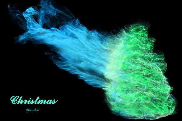 Christmas tree out of the smoke and particles - Photo, Image