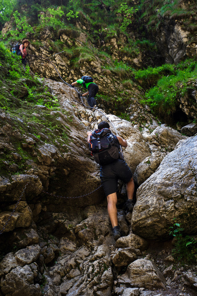 hikers with backpacks on difficult trail - Fotografie, Obrázek