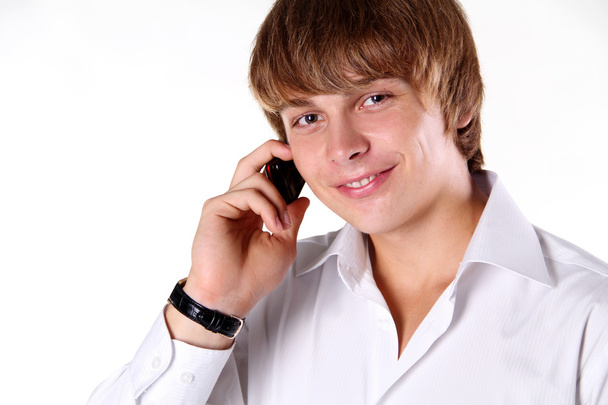 Portrait of a handsome young man talking on mobile phone - Photo, image
