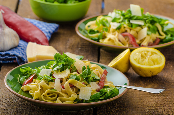 Tagliatelle with bacon, garlic and salad - Photo, Image