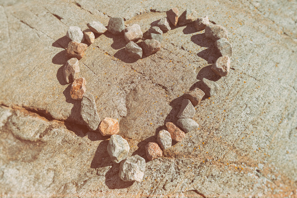 Stones in a heart shaped love sign - Foto, afbeelding
