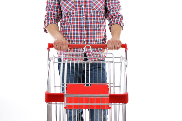 man with empty shopping cart - Foto, afbeelding