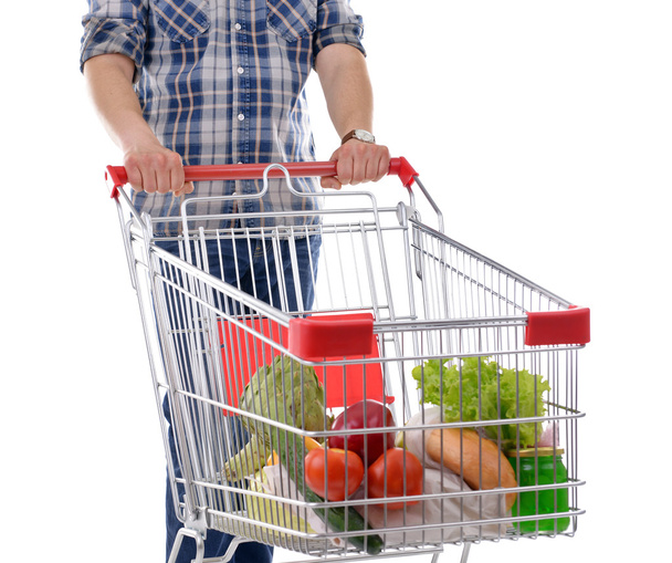 Young man and shopping cart - Foto, Imagen