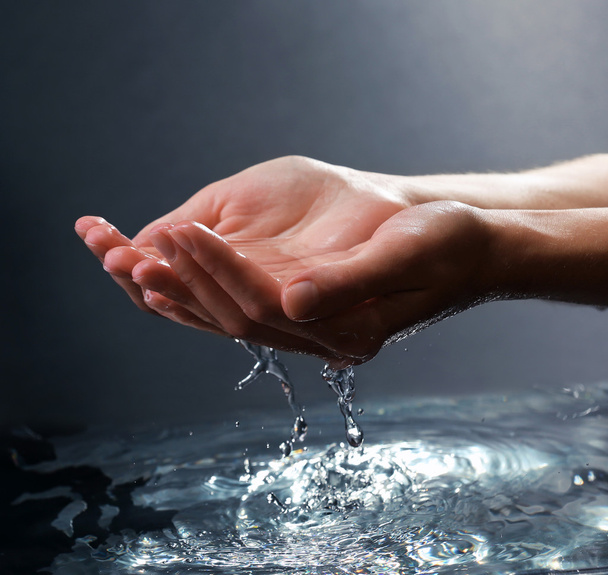 Female hands with water splashing - Fotoğraf, Görsel