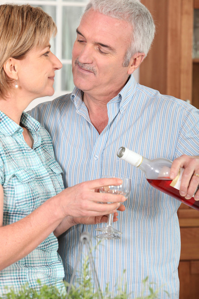 Middle-aged couple with wine - Photo, Image