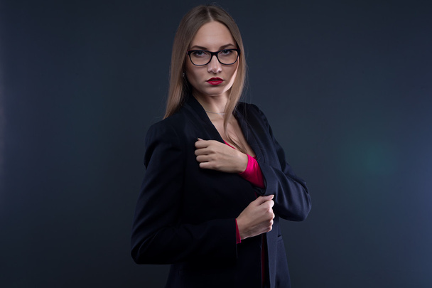 Image of serious woman in black jacket  - Фото, изображение