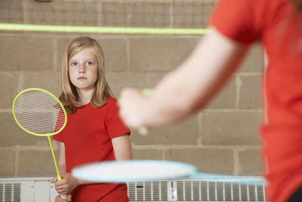 Two Girl Playing Badminton In School Gym - Fotó, kép