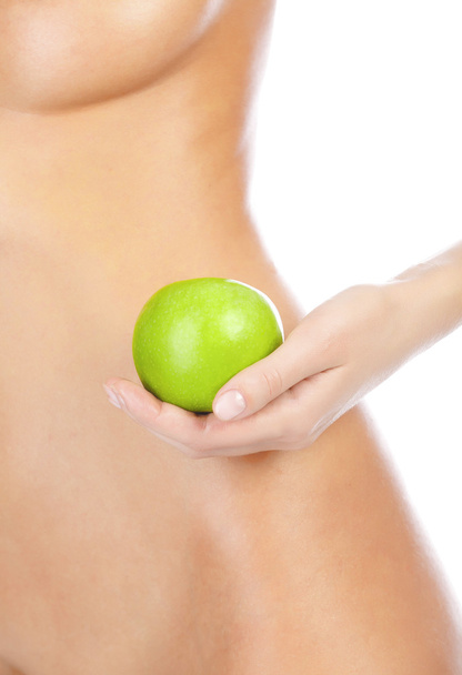 Beautiful woman body and green apple. - Photo, Image