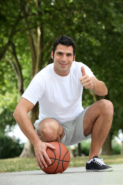 Portrait of a man with basket-ball - 写真・画像