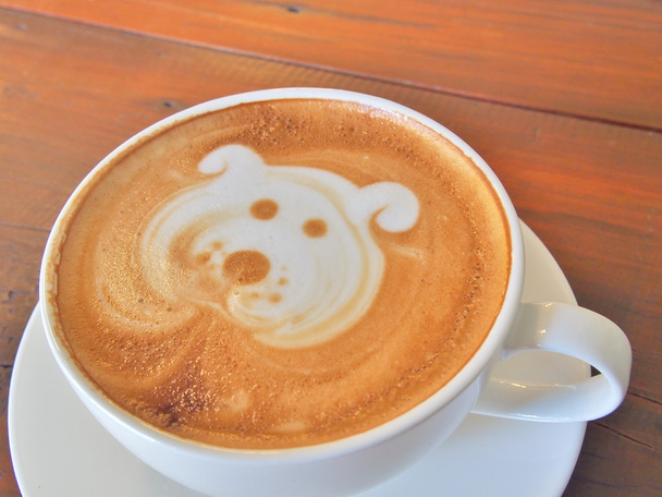 Káva Latte art na dřevěný stůl. - Fotografie, Obrázek