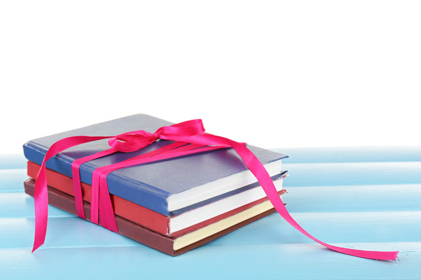 Stack of books with ribbon - Fotoğraf, Görsel
