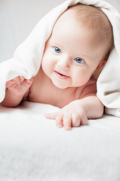 Happy baby after bathing, looks towards on copy space - Zdjęcie, obraz