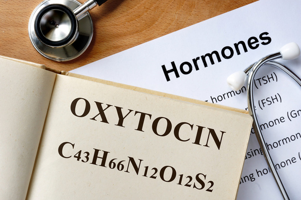 oxytocin  word written on the book and hormones list. - Foto, afbeelding