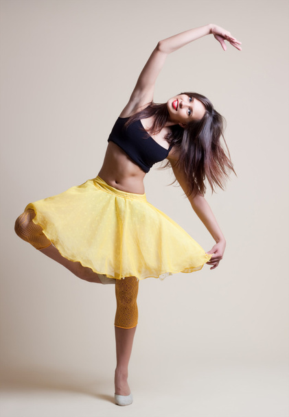Modern ballet dancer dancing on the white studio background - Foto, imagen