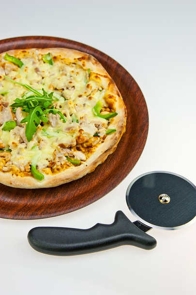 Chicken Pasta on Tray and Pizza Cutter on white - Photo, Image
